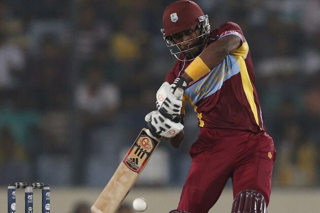 West Indies' batsman Dwayne Bravo plays a shot during their ICC Twenty20 Cricket World Cup semifinal match against Sri Lanka in Dhaka, Bangladesh, Thursday, April 3, 2014. (AP Photo/Aijaz Rahi)