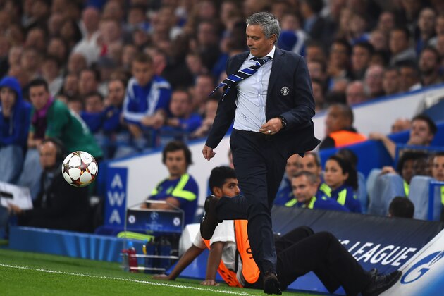 LONDON, ENGLAND - SEPTEMBER 17:  Chelsea manager Jose Mourinho chases the ball down the wing during the UEFA Champions League Group G match between Chelsea FC and FC Schalke 04 at Stamford Bridge on September 17, 2014 in London, United Kingdom.  (Photo by Mike Hewitt/Getty Images)