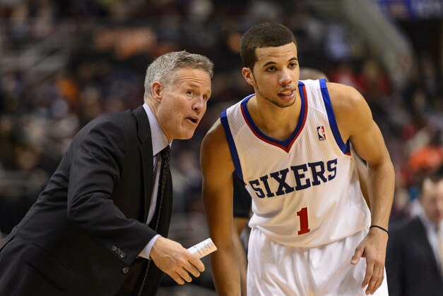 Mar 19, 2014; Philadelphia, PA, USA; Philadelphia 76ers head coach Brett Brown talks with guard Michael Carter-Williams (1) during the fourth quarter against the Chicago Bulls at the Wells Fargo Center. The Bulls defeated the Sixers 102-94. Mandatory Credit: Howard Smith-USA TODAY Sports