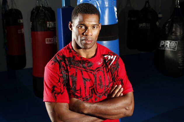 Former NFL football player Herschel Walker poses for a photograph after training at American Kickboxing Academy in San Jose, Calif., Tuesday, Dec. 8, 2009.  Walker, the 1982 Heisman Trophy winner, will make his Strikeforce mixed martial arts fight debut on January 30, 2010, against an opponent to be announced. (AP Photo/Jeff Chiu)