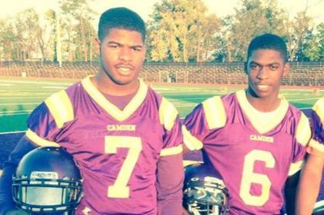 Ron Johnson, left, and Brad Hawkins hold Buckeyes offers.