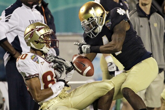 Florida State wide receiver Rashad Greene (80) catches a 42-yard pass in front of Notre Dame cornerback Gary Gray, right, during the second half of the Champs Sports Bowl NCAA college football game, Thursday, Dec. 29, 2011, in Orlando, Fla. Florida State won 18-14. (AP Photo/John Raoux)