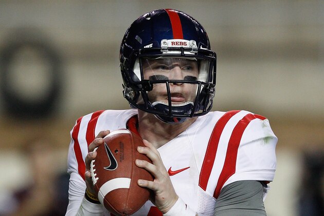 Mississippi quarterback Bo Wallace (14) looks for a receiver against Texas A&M during the fourth quarter of an NCAA college football game Saturday, Oct. 11,  2014, in College Station, Texas. (AP Photo/Bob Levey)