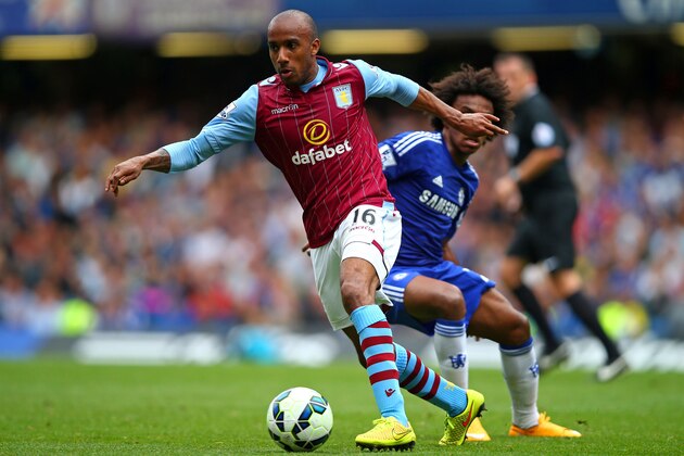 LONDON, ENGLAND - SEPTEMBER 27:  Fabian Delph of Aston Villa goes past the challenge from Willian of Chelsea during the Barclays Premier League match between Chelsea and Aston Villa at Stamford Bridge on September 27, 2014 in London, England.  (Photo by Clive Rose/Getty Images)