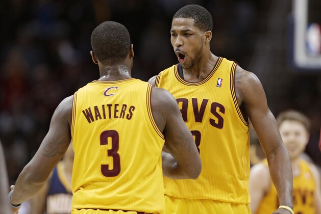 Cleveland Cavaliers' Tristan Thompson, right, from Canada, celebrates with Dion Waiters during an NBA basketball game against the Indiana Pacers Sunday, Jan. 5, 2014, in Cleveland. (AP Photo/Tony Dejak)
