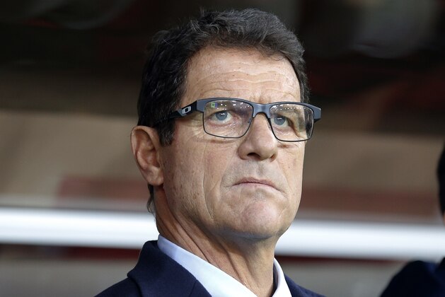 Russia’s team coach Fabio Capello looks at his team prior to a Euro 2016 Group G qualifying round soccer match between Russia and Moldova at the Otkrytie Arena of Spartak Moscow soccer club in Moscow, Russia, Sunday, Oct. 12, 2014. (AP Photo/Alexander Zemlianichenko)
