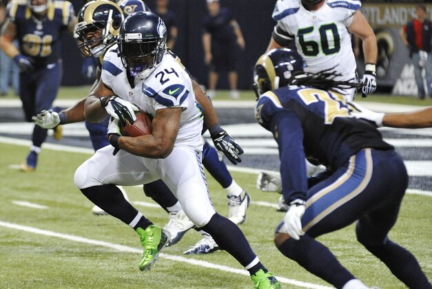 Oct 28, 2013; St. Louis, MO, USA; Seattle Seahawks running back Marshawn Lynch (24) runs the ball against the St. Louis Rams during the second half at Edward Jones Dome. The Seahawks defeat the Rams 14-9. Mandatory Credit: Jasen Vinlove-USA TODAY Sports