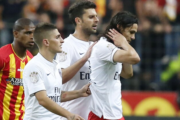 PSG's Marco Verratti, left, and Javier Pastore, center, commiserate teammate Edinson Cavani, right, after he got a red card during their League One soccer match Lens  against Paris Saint Germain at Stade de France stadium in Saint Denis, outside Paris, France, Friday, Oct. 17, 2014. (AP Photo/Michel Euler)