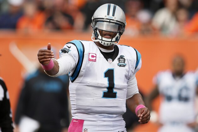 Carolina Panthers quarterback Cam Newton gives direction against the Cincinnati Bengals in the second half of an NFL football game, Sunday, Oct. 12, 2014, in Cincinnati. (AP Photo/Paul Sancya)