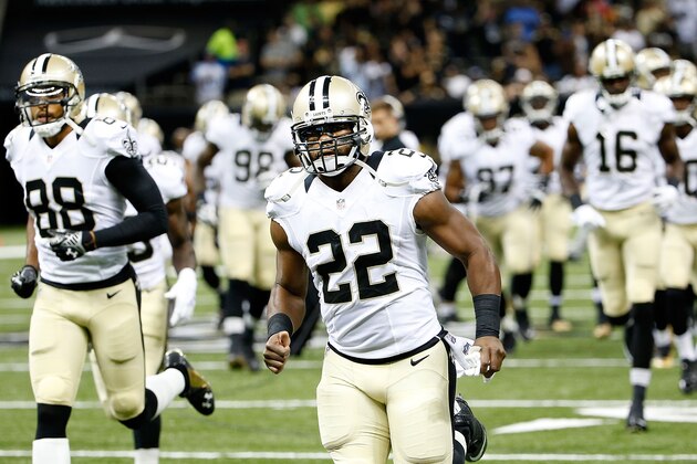 NEW ORLEANS, LA - AUGUST 15:  Mark Ingram #22 of the New Orleans Saints take to the field at the start of the first half during a preseason game against the Tennessee Titans at Mercedes-Benz Superdome on August 15, 2014 in New Orleans, Louisiana.  (Photo by Stacy Revere/Getty Images)