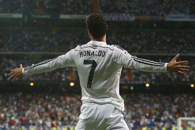 Real's Cristiano Ronaldo celebrates his third goal during a Spanish La Liga soccer match between Real Madrid and Athletic Bilbao at the Santiago Bernabeu stadium in Madrid, Spain, Sunday, Oct. 5, 2014. (AP Photo/Andres Kudacki)