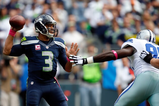 SEATTLE, WA - OCTOBER 12:  Quarterback Russell Wilson #3 of the Seattle Seahawks passes the ball during the first quarter of the game against the Dallas Cowboys at CenturyLink Field on October 12, 2014 in Seattle, Washington.  (Photo by Otto Greule Jr/Getty Images)