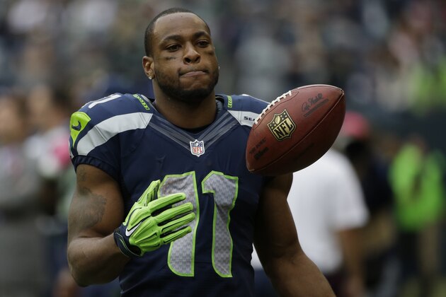 Seattle Seahawks wide receiver Percy Harvin stands on the sideline late in the second half of the Seattle Seahawks' 30-23 loss to the Dallas Cowboys in an NFL football game, Sunday, Oct. 12, 2014, in Seattle. (AP Photo/Elaine Thompson)