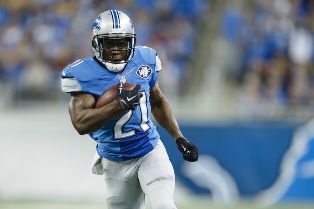Detroit Lions running back Reggie Bush (21) breaks away for a 26-yard rushing touchdown against the Green Bay Packers during the second half of an NFL football game in Detroit, Sunday, Sept. 21, 2014. (AP Photo/Rick Osentoski)