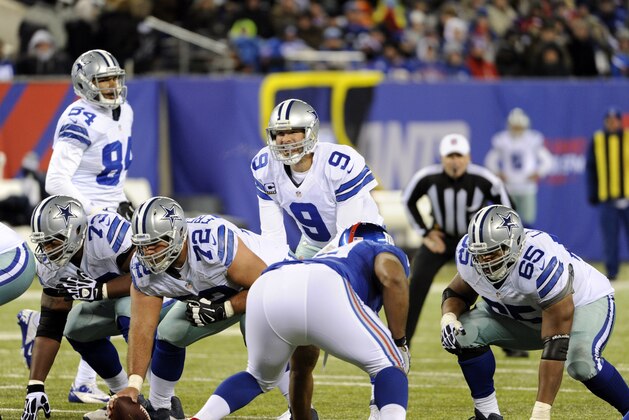 Dallas Cowboys quarterback Tony Romo (9) barks out signals before taking the snap fro center Travis Frederick (72) during the second half of an NFL football game against the New York Giants, Sunday, Nov. 24, 2013, in East Rutherford, N.J. (AP Photo/Bill Kostroun)