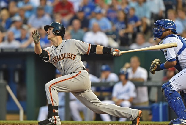Aug 8, 2014; Kansas City, MO, USA; San Francisco Giants catcher Buster Posey (28) at bat against the Kansas City Royals during the third inning at Kauffman Stadium. Mandatory Credit: Peter G. Aiken-USA TODAY Sports