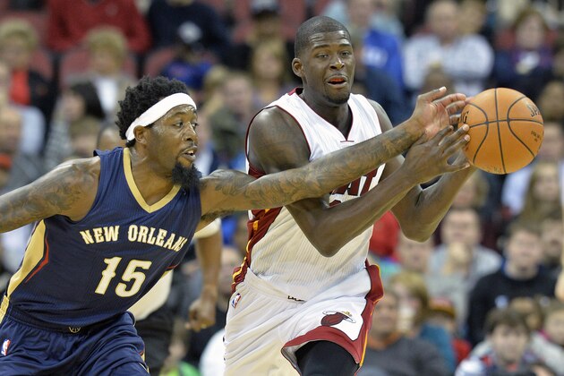 New Orleans Pelicans' John Salmons, left, knocks the ball away from Miami Heat's James Ennis during the second quarter of an NBA basketball preseason game in Louisville, Ky., Saturday, Oct. 4, 2014. (AP Photo/Timothy D. Easley)