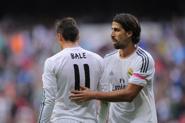 MADRID, SPAIN - OCTOBER 19:  Gareth Bale of Real Madrid CF is congradulated by Sami Khedira after he was awarded a penalty kick during the La Liga match between Real Madrid CF and Malaga CF at the Santiago Bernabeu stadium on October 19, 2013 in Madrid, Spain.  (Photo by Denis Doyle/Getty Images)