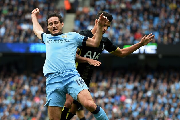 MANCHESTER, ENGLAND - OCTOBER 18:  Frank Lampard of Manchester City wins his team's first peanlty as he is brought down by Erik Lamela of Spurs during the Barclays Premier League match between Manchester City and Tottenham Hotspur at Etihad Stadium on October 18, 2014 in Manchester, England.  (Photo by Michael Regan/Getty Images)