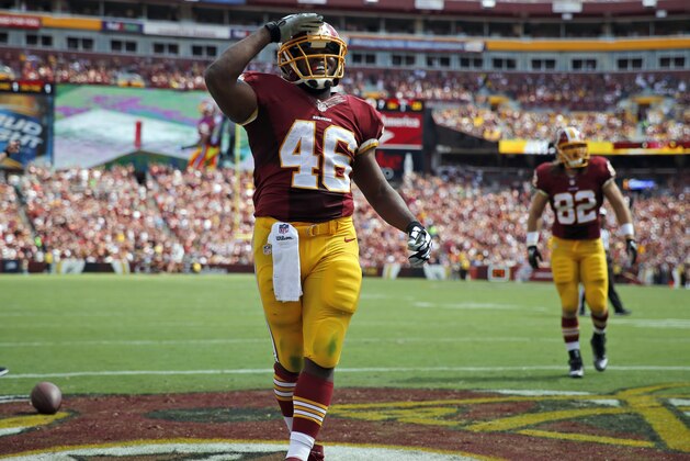 Washington Redskins running back Alfred Morris (46) celebrates his touchdown during the first half of an NFL football game against the Jacksonville Jaguars, Sunday, Sept. 14, 2014, in Landover, Md. (AP Photo/Evan Vucci)