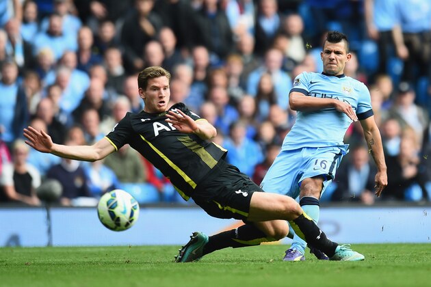 MANCHESTER, ENGLAND - OCTOBER 18:  Sergio Aguero of Manchester City shoots past Jan Vertonghen of Tottenham Hotspur to score his fourth goal during the Barclays Premier League match between Manchester City and Tottenham Hotspur at Etihad Stadium on October 18, 2014 in Manchester, England.  (Photo by Shaun Botterill/Getty Images)