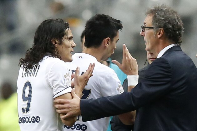 PSG's Uruguayan Edinson Cavani, left, talks to PSG's head coach Laurent Blanc, after he as been send off during a League One soccer match Lens  against Paris Saint Germain at Stade de France stadium in Saint Denis, outside Paris, France, Friday, Oct. 17, 2014. Paris Saint Germain won 3-0. (AP Photo/Michel Euler)