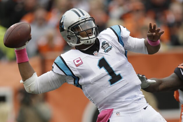 Carolina Panthers quarterback Cam Newton passes against the Cincinnati Bengals in the second half of an NFL football game, Sunday, Oct. 12, 2014, in Cincinnati. (AP Photo/AJ Mast)