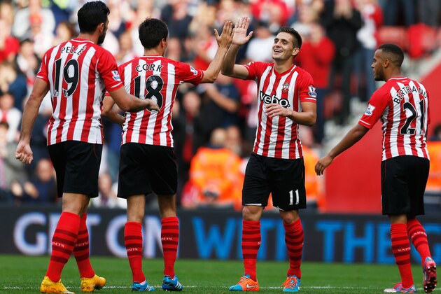 SOUTHAMPTON, ENGLAND - OCTOBER 18:  Jack Cork (18) and Dusan Tadic of Southampton (11) celebrate during the Barclays Premier League match between Southampton and Sunderland at St Mary's Stadium on October 18, 2014 in Southampton, England.  (Photo by Steve Bardens/Getty Images)