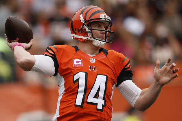 Cincinnati Bengals quarterback Andy Dalton passes against the Carolina Panthers in the second half of an NFL football game, Sunday, Oct. 12, 2014, in Cincinnati. (AP Photo/Paul Sancya)