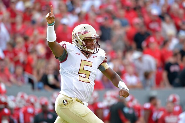 RALEIGH, NC - SEPTEMBER 27: Jameis Winston #5 of the Florida State Seminoles celebrates after throwing a first quarter touchdown pass during their game against the North Carolina State Wolfpack at Carter-Finley Stadium on September 27, 2014 in Raleigh, North Carolina. (Photo by Grant Halverson/Getty Images)