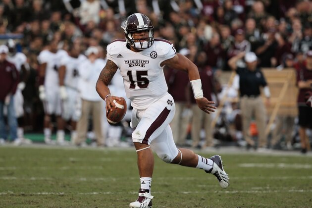 COLLEGE STATION, TX - NOVEMBER 09:  Dak Prescott #15 of the Mississippi State Bulldogs looks to pass against the Texas A&M Aggies at Kyle Field on November 9, 2013 in College Station, Texas.  (Photo by Scott Halleran/Getty Images)