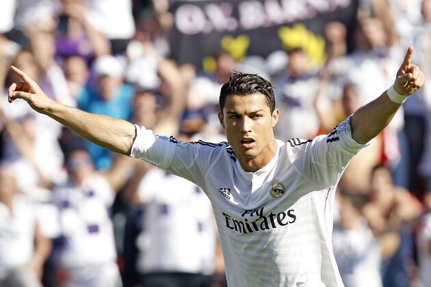 Real Madrid's Cristiano Ronaldo from Portugal celebrates scoring against Levante during a Spanish La Liga soccer match at the Ciutat de Valencia stadium in Valencia, Spain, on Saturday, Oct. 18, 2014. (AP Photo/Alberto Saiz)