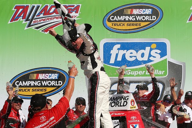 TALLADEGA, AL - OCTOBER 18:  Timothy Peters, driver of the #17 Red Horse Racing Toyota, celebrates after winning the NASCAR Camping World Series Fred's 250 Powered by Coca-Cola at Talladega Superspeedway on October 18, 2014 in Talladega, Alabama.  (Photo by Mike Ehrmann/Getty Images)