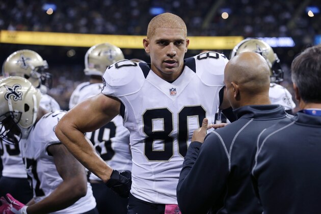 New Orleans Saints tight end Jimmy Graham (80) talks on the sideline in the first half of an NFL football game against the Tampa Bay Buccaneers in New Orleans, Sunday, Oct. 5, 2014. (AP Photo/Bill Haber)