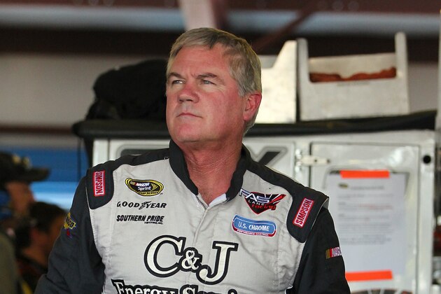 TALLADEGA, AL - OCTOBER 18:  Terry Labonte, driver of the #32 C&J Energy Services Ford, stands in the garage area during practice for the NASCAR Sprint Cup Series 45th Annual Camping World RV Sales 500 at Talladega Superspeedway on October 18, 2013 in Talladega, Alabama.  (Photo by Jonathan Ferrey/Getty Images)