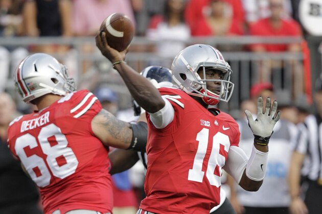 Ohio State quarterback J.T. Barrett plays against Cincinnati during an NCAA college football game Saturday, Sept. 27, 2014, in Columbus, Ohio. (AP Photo/Jay LaPrete)