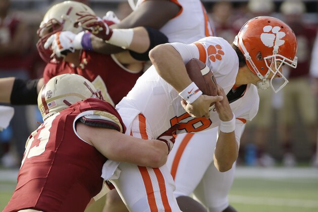 Clemson quarterback Cole Stoudt (18) is sacked by Boston College defensive end Kevin Kavalec (93) during the first quarter of an NCAA college football game Saturday, Oct. 18, 2014, in Boston. (AP Photo/Stephan Savoia)