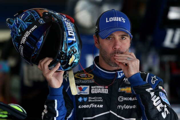 TALLADEGA, AL - OCTOBER 17:  Jimmie Johnson, driver of the #48 Lowe's Chevrolet, stands in the garage area during practice for the NASCAR Sprint Cup Series GEICO 500 at Talladega Superspeedway on October 17, 2014 in Talladega, Alabama.  (Photo by Todd Warshaw/Getty Images)