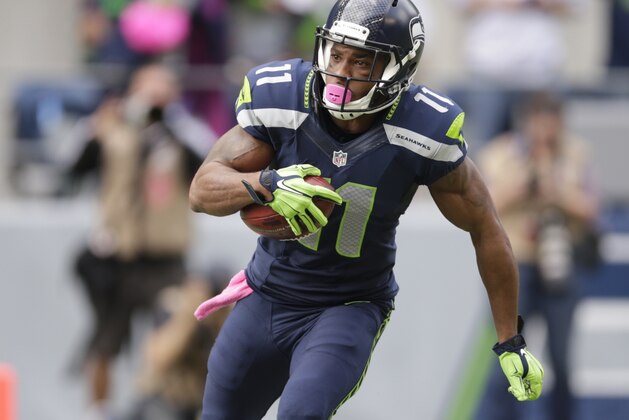 Seattle Seahawks' Percy Harvin returns a kickoff in the second half of an NFL football game against the Dallas Cowboys, Sunday, Oct. 12, 2014, in Seattle. (AP Photo/Scott Eklund)