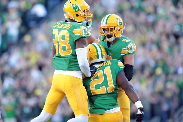 Oct 18, 2014; Eugene, OR, USA; Oregon Ducks wide receiver Dwayne Stanford (88) and  wide receiver Devon Allen (5) celebrate a touchdown by running back Royce Freeman (21) against the Washington Huskies at Autzen Stadium. Mandatory Credit: Scott Olmos-USA TODAY Sports