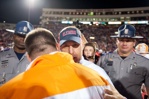 OXFORD, MS - OCTOBER 18: Head coach Hugh Freeze of the Mississippi Rebels hugs head coach Butch Jones of the Tennessee Volunteers on October 18, 2014 at Vaught-Hemingway Stadium in Oxford, Mississippi. The Mississippi Rebels defeated the Tennessee Volunteers 34-3. (Photo by Michael Chang/Getty Images)