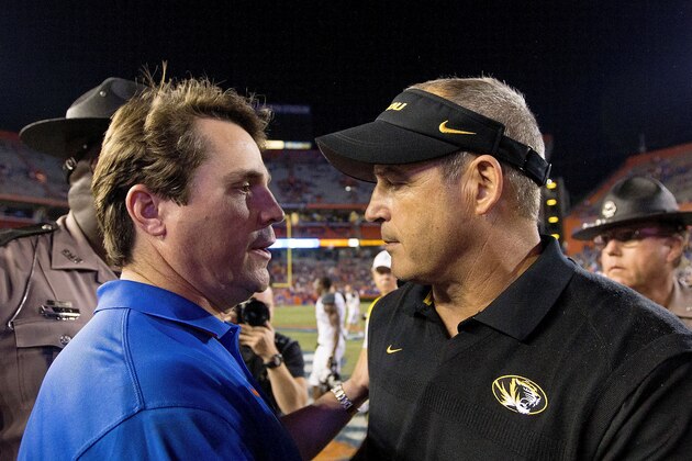 GAINESVILLE, FL - OCTOBER 18: Head coaches Will Muschamp (left) of the Florida Gators and Gary Pinkel (right) of the Missouri Tigers shake hands after the game at Ben Hill Griffin Stadium on October 18, 2014 in Gainesville, Florida.  (Photo by Rob Foldy/Getty Images)
