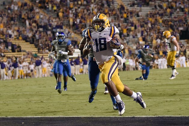 BATON ROUGE, LA - OCTOBER 18:  Terrence Magee #18 of the LSU Tigers scores a touchdown against the Kentucky Wildcats during the third quarter of a game at Tiger Stadium on October 18, 2014 in Baton Rouge, Louisiana.  LSU won the game 41-3.  (Photo by Stacy Revere/Getty Images)