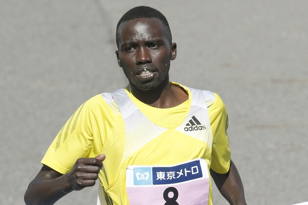 Bernard Kipyego of Kenya crosses the finish line to place third in the men's race of the Tokyo Marathon in Tokyo, Sunday, Feb. 24, 2013. (AP Photo/Shizuo Kambayashi, Pool)