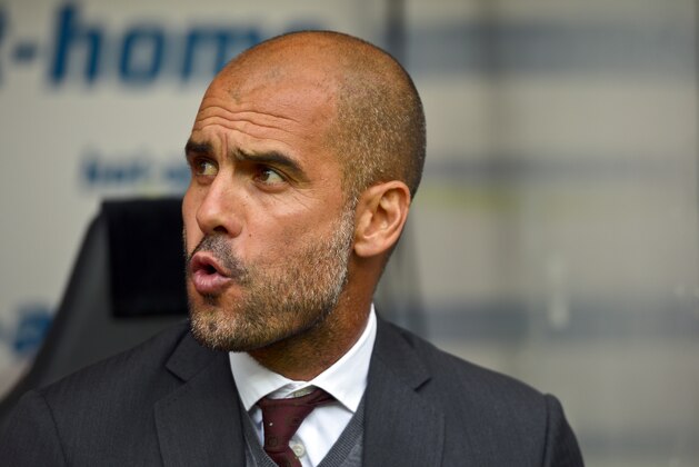 Munich's coach Pep Guardiola reacts during the German soccer Super Cup match between Borussia Dortmund and Bayern Munich in Dortmund, Germany, Wednesday, Aug. 13, 2014. (AP Photo/Sascha Schuermann)