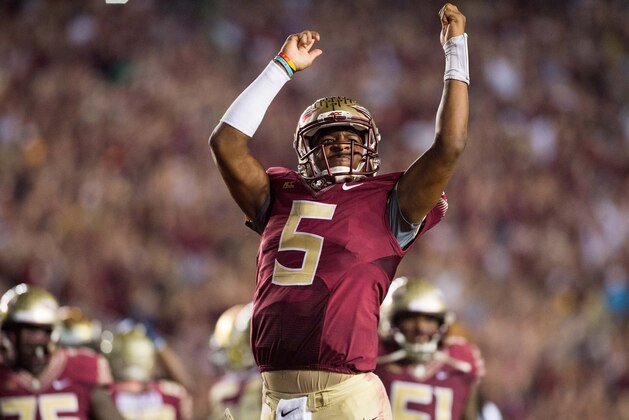 Oct 18, 2014; Tallahassee, FL, USA; Florida State Seminoles quarterback Jameis Winston (5) celebrates after defeating the Notre Dame Fighting Irish 31-27 at Doak Campbell Stadium. Mandatory Credit: Matt Cashore-USA TODAY Sports