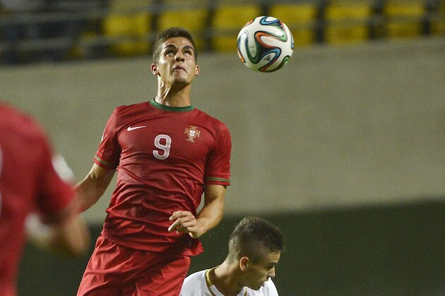 Andre Silva of Portugal, left, and Mijat Gacinivic of Serbia vie for the ball during their U19 European Championship soccer match in Pancho Arena in Felcsut, 41 kms southwest of Budapest, Hungary, Monday, July 28, 2014. (AP Photo/MTI, Tibor Illyes)
