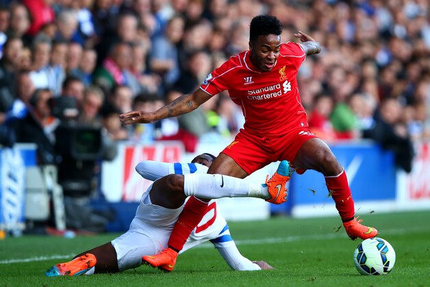 LONDON, ENGLAND - OCTOBER 19:  Raheem Sterling of Liverpool battles for the ball with Leroy Fer of QPR during the Barclays Premier League match between Queens Park Rangers and Liverpool at Loftus Road on October 19, 2014 in London, England.  (Photo by Clive Rose/Getty Images)