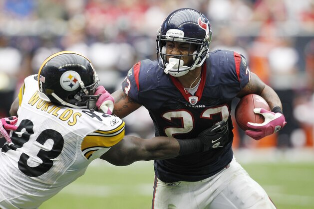 Pittsburgh Steelers' Jason Worilds, left, and Houston Texans' Arian Foster (23) in the second quarter of an NFL football game Sunday, Oct. 2, 2011, in Houston. (AP Photo/Eric Gay)