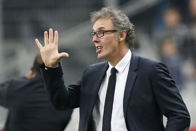 PSG's coach Laurent Blanc gestures during a League One soccer match Lens  against Paris Saint Germain at Stade de France stadium in Saint Denis, outside Paris, France, Friday, Oct. 17, 2014. Paris Saint Germain won 3-1. (AP Photo/Michel Euler)